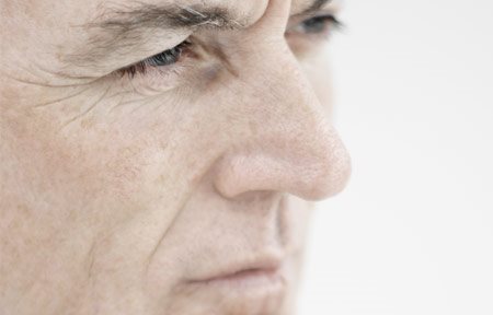 Close-up van het gezicht van een oudere man